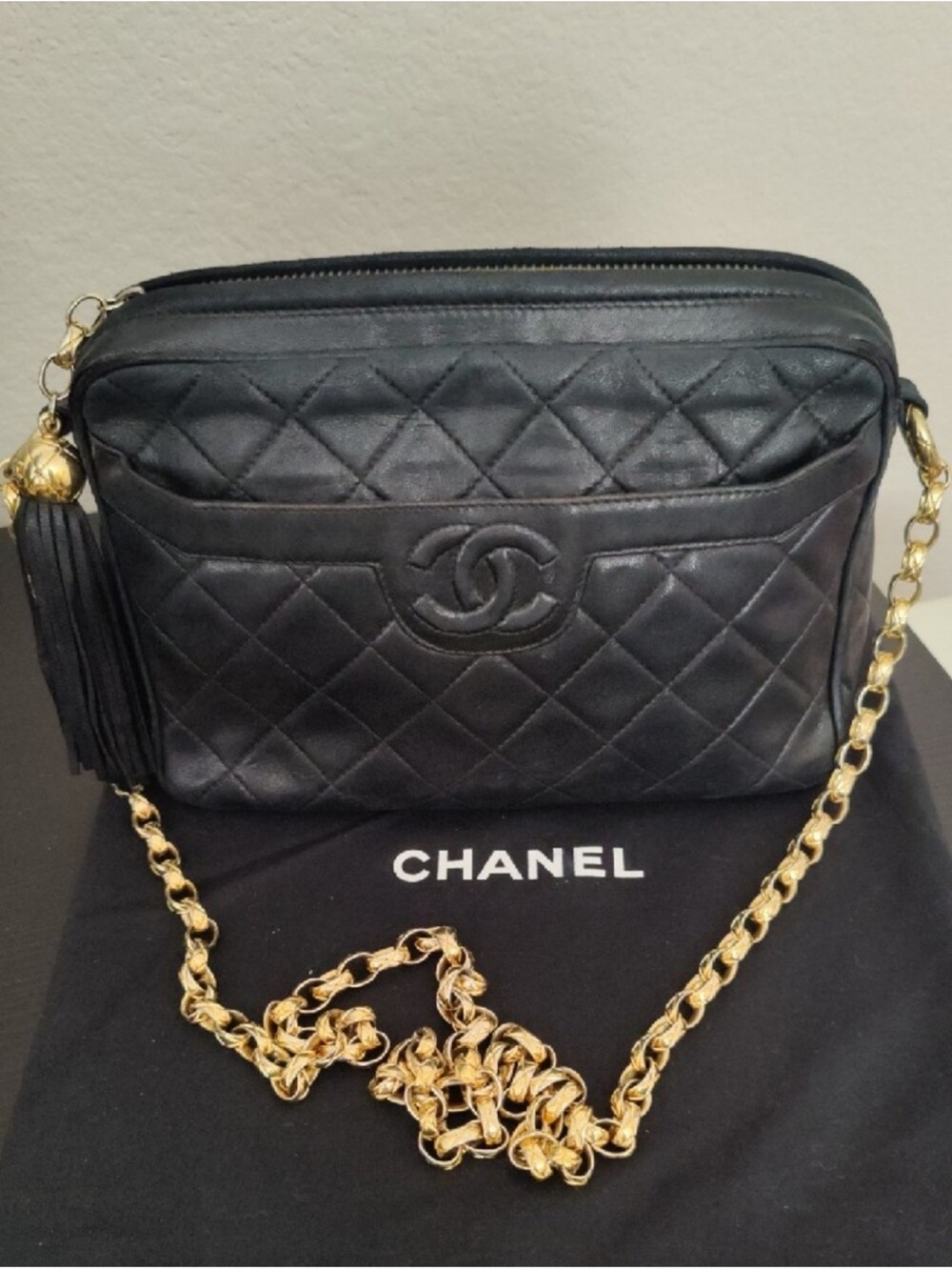 CHANEL Black Quilted Lambskin Crossbody with Gold Chain and Tassel